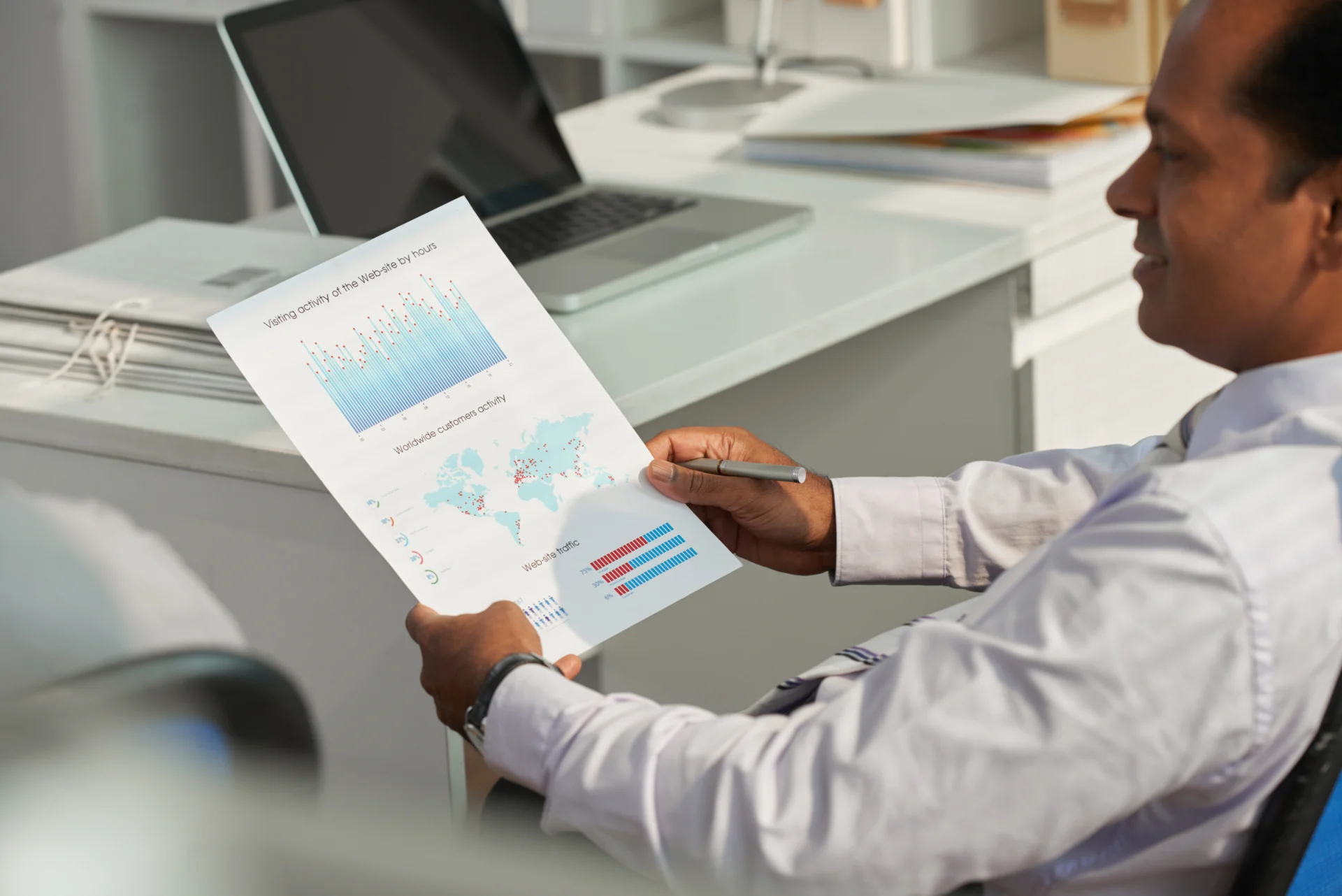 A policymaker reviewing digital dashboards with graphs, community indicators, and social metrics.