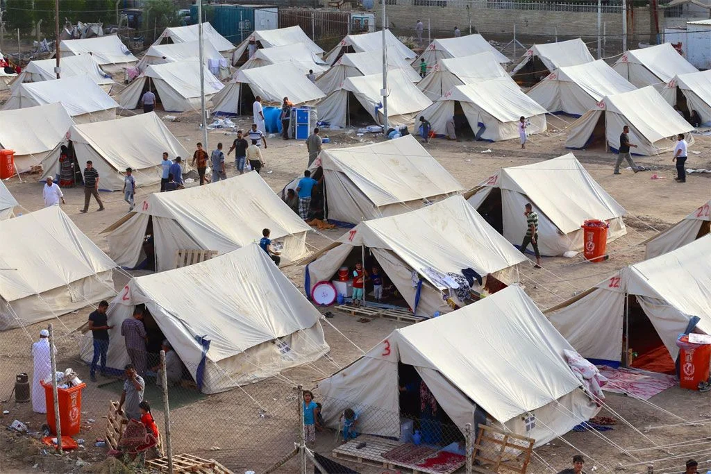 Researchers conducting data gathering in conflict settings within African IDP camps to capture real human experiences.
