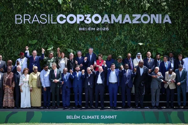 Delegates at COP30 government session discussing climate policy frameworks