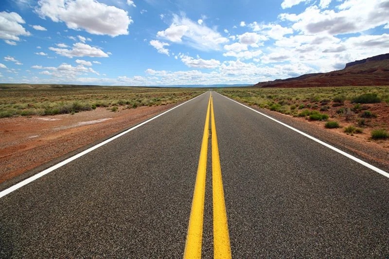 Youth disillusionment and migration symbolized by an open road