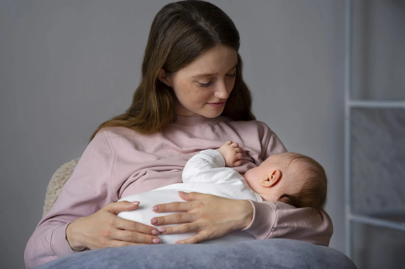Mother breastfeeding her baby in a comfortable home environment