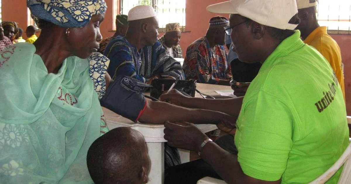 Community health worker discussing heat-related health risks with residents